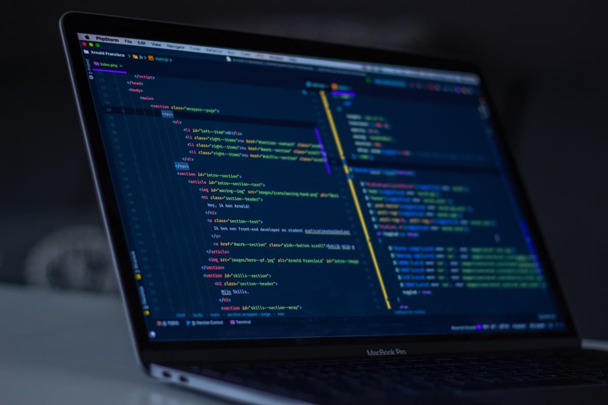 Application source code displayed across a developer's monitor