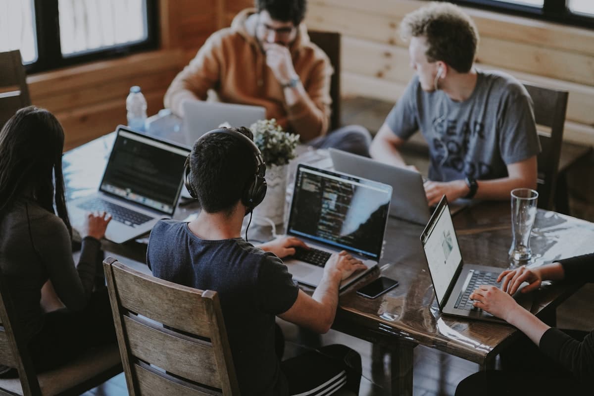 Two developers reviewing code together at a workstation