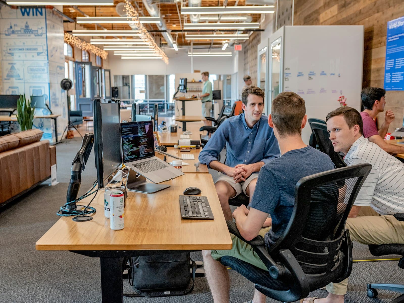 The InnovativeVibe team working together across a shared studio floor